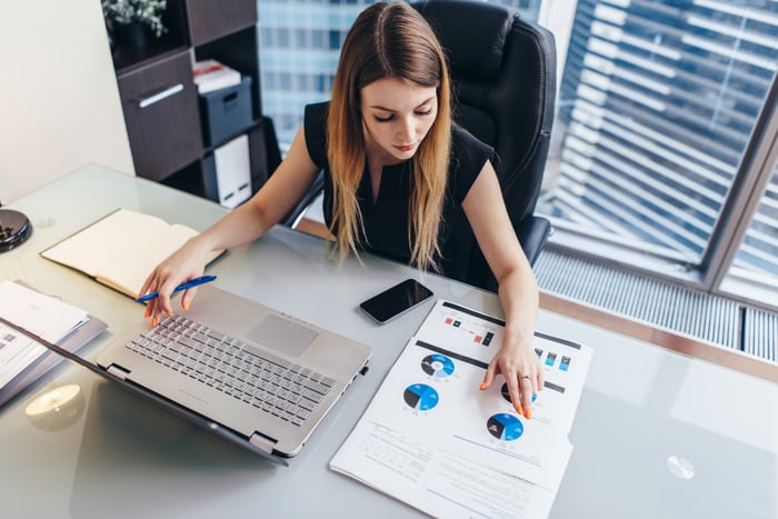 A businessperson prepares financial reports.
