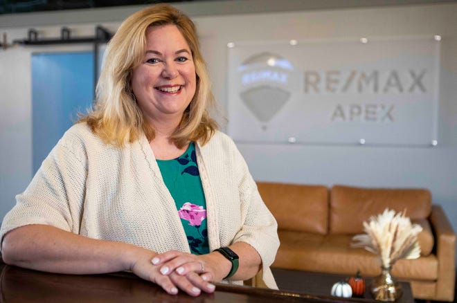Real estate broker Megan Bell sits inside the ReMax office on Oct.  31, 2022 in Lithopolis, Ohio.
